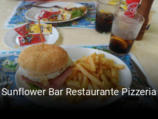 Reserve ahora una mesa en Sunflower Bar Restaurante Pizzeria